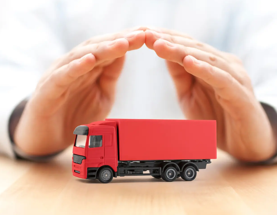Screenshot 2025-09-12 023400 A pair of hands grasping a red truck toy, positioned over a table, highlighting the playful nature of the scene