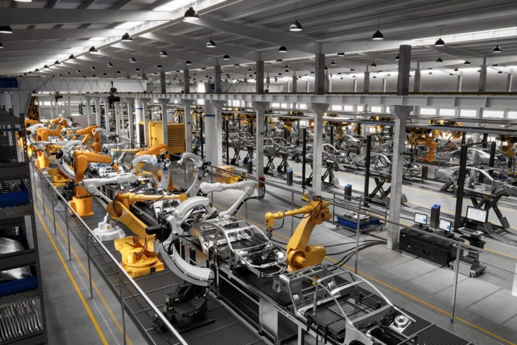blog-images-manufacturing-line-1024x683 A busy industrial factory showcasing robots and machines operating in a synchronized manner